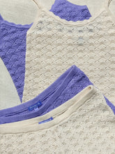 Florence by Mills textured lace-knit tops in cream and lavender, arranged on fabric.