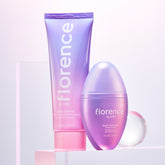 Florence by Mills skincare set with cleansing balm and glaze drops in purple ombre packaging.